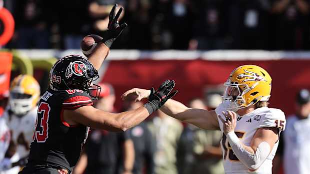Nov 4, 2023; Salt Lake City, Utah, USA; Arizona State Sun Devils quarterback Jacob Conover (15) has pass deflected by Utah Utes defensive end Jonah Elliss (83) in the second quarter at Rice-Eccles Stadium. Mandatory Credit: Rob Gray-USA TODAY Sports